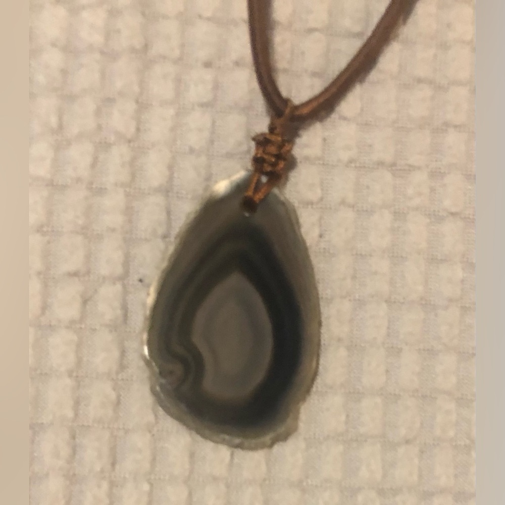 Agate slice pendant on a brown detailed cord, pull to size
